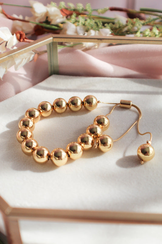Pulsera ajustable de cuentas doradas