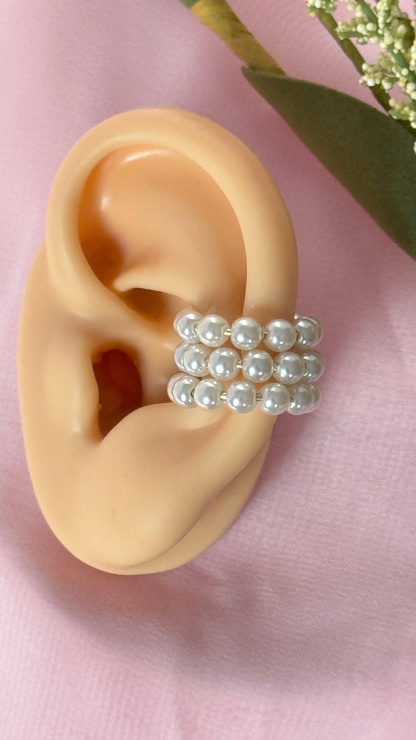 Puño de oreja de perla (forma de 3 C)