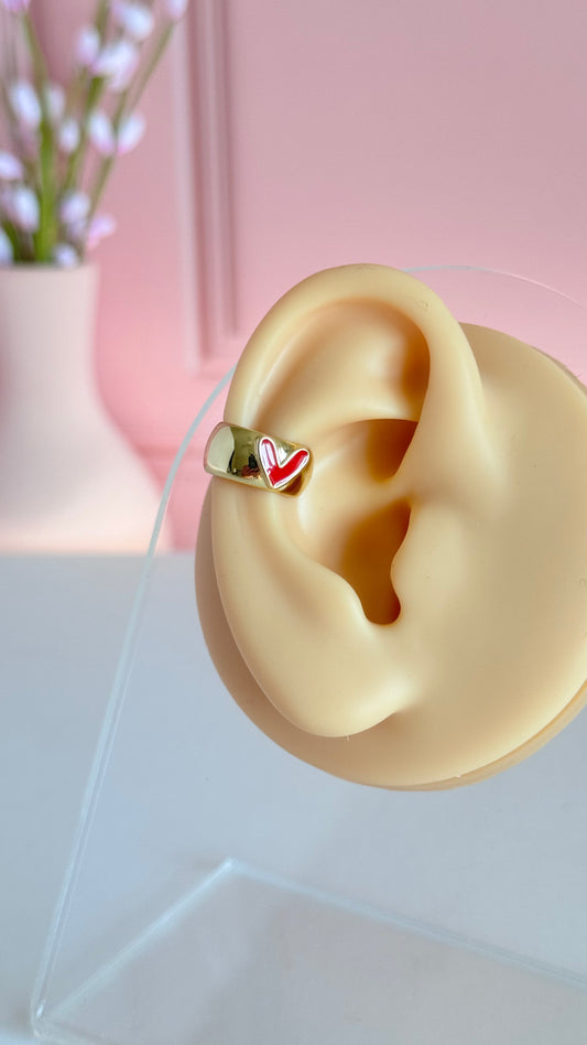 Puño para la oreja con forma de latido del corazón